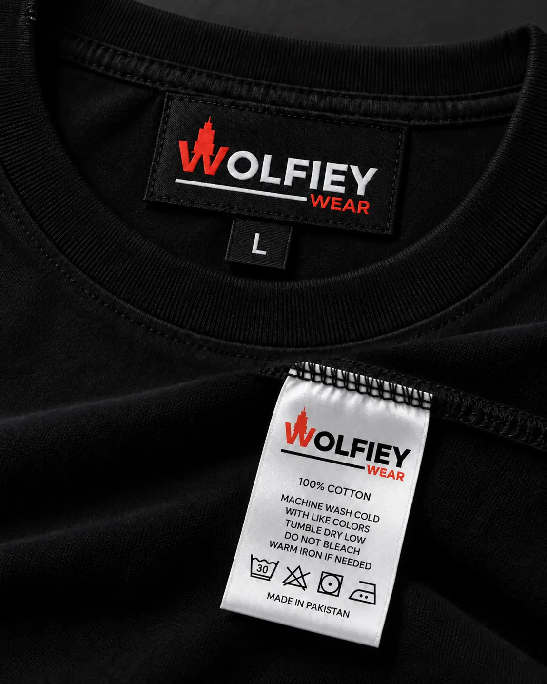 Wolfiey Wear woven neck label size tab and satin care label sewn into a black garment